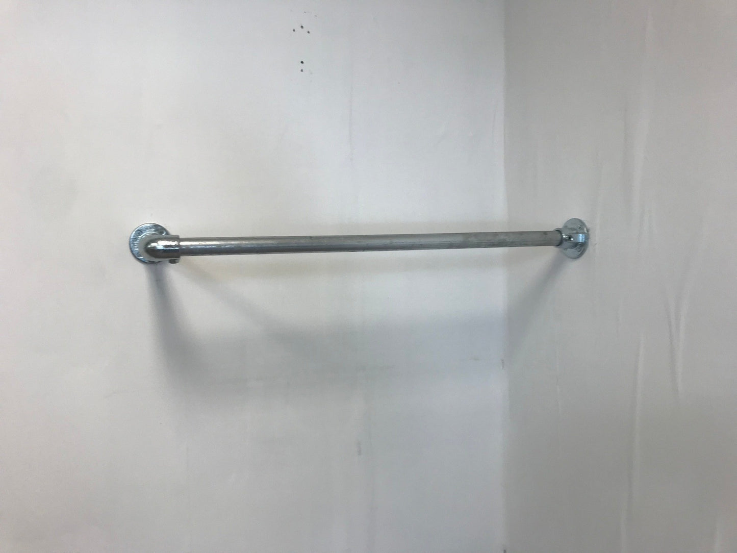 Corner fixed Clothing Rail in thick 33.7 tube, Including all wall fixings