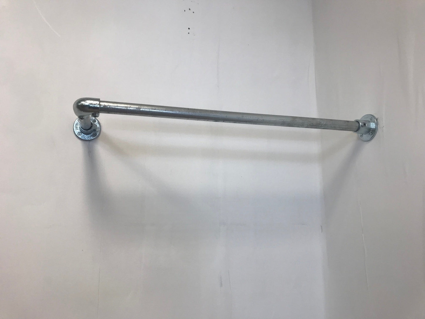 Corner fixed Clothing Rail in thick 33.7 tube, Including all wall fixings