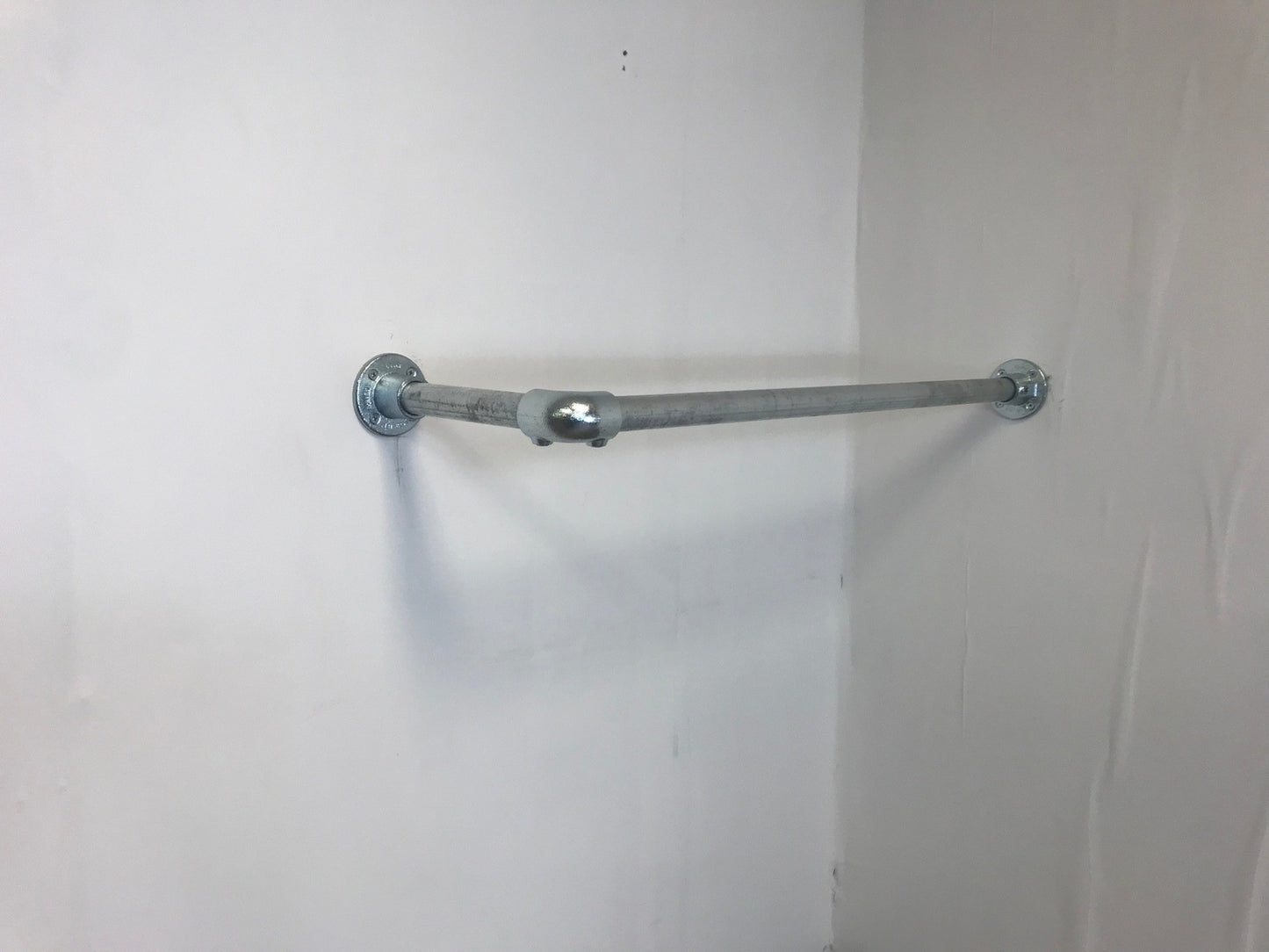 Corner fixed Clothing Rail in thick 33.7 tube, Including all wall fixings