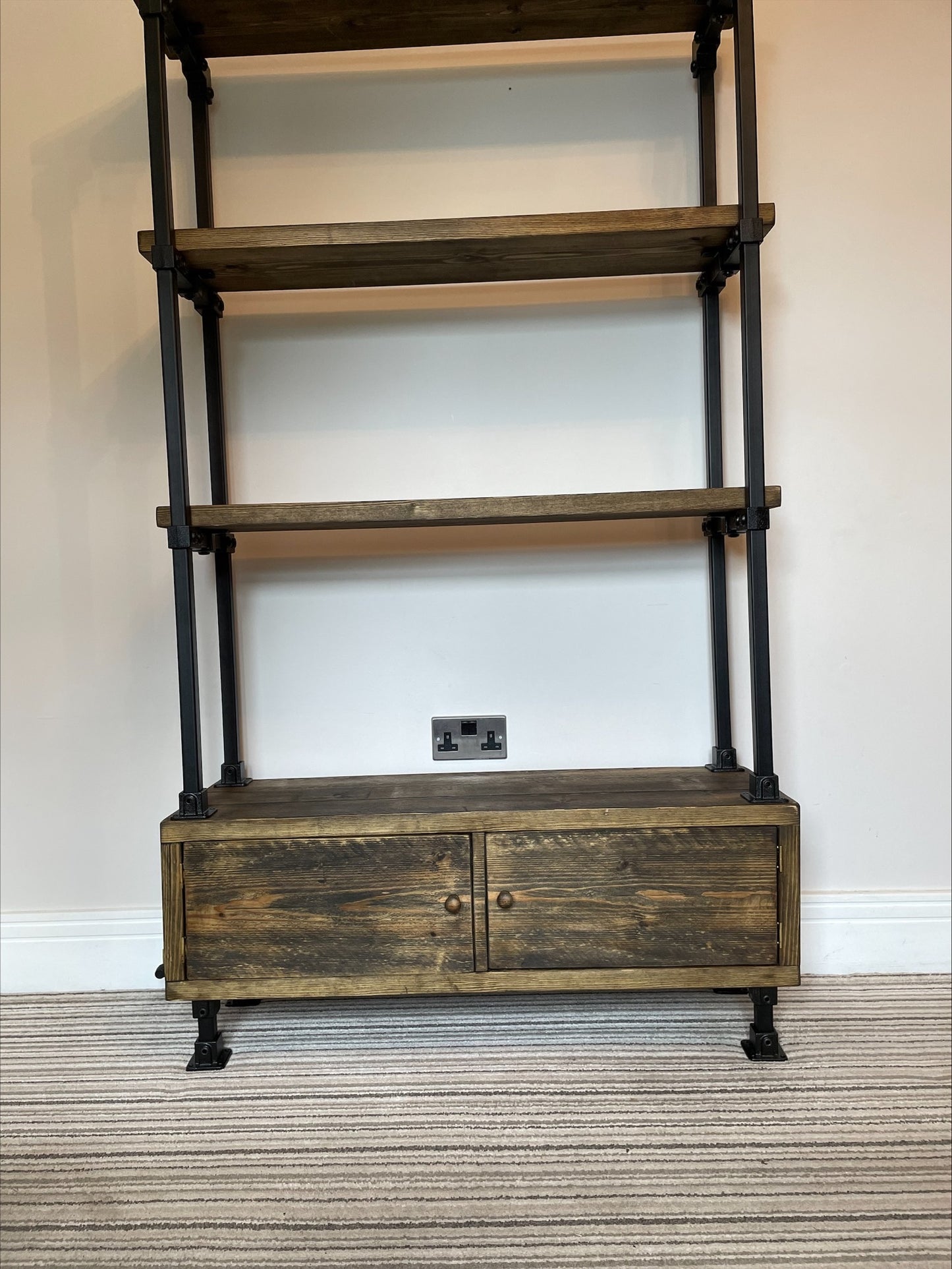 Industrial/Rustic Ladder Style Shelving Unit with Cupboard and black framework.