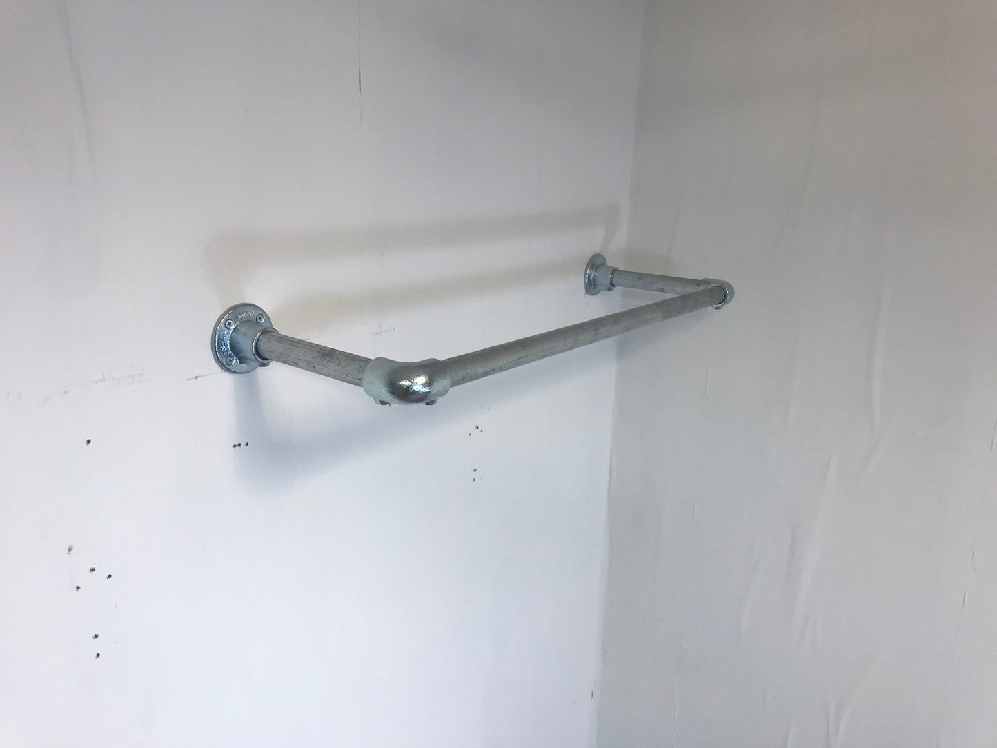 Wall fixed clothing rail in various widths. Black or galvanised silver.