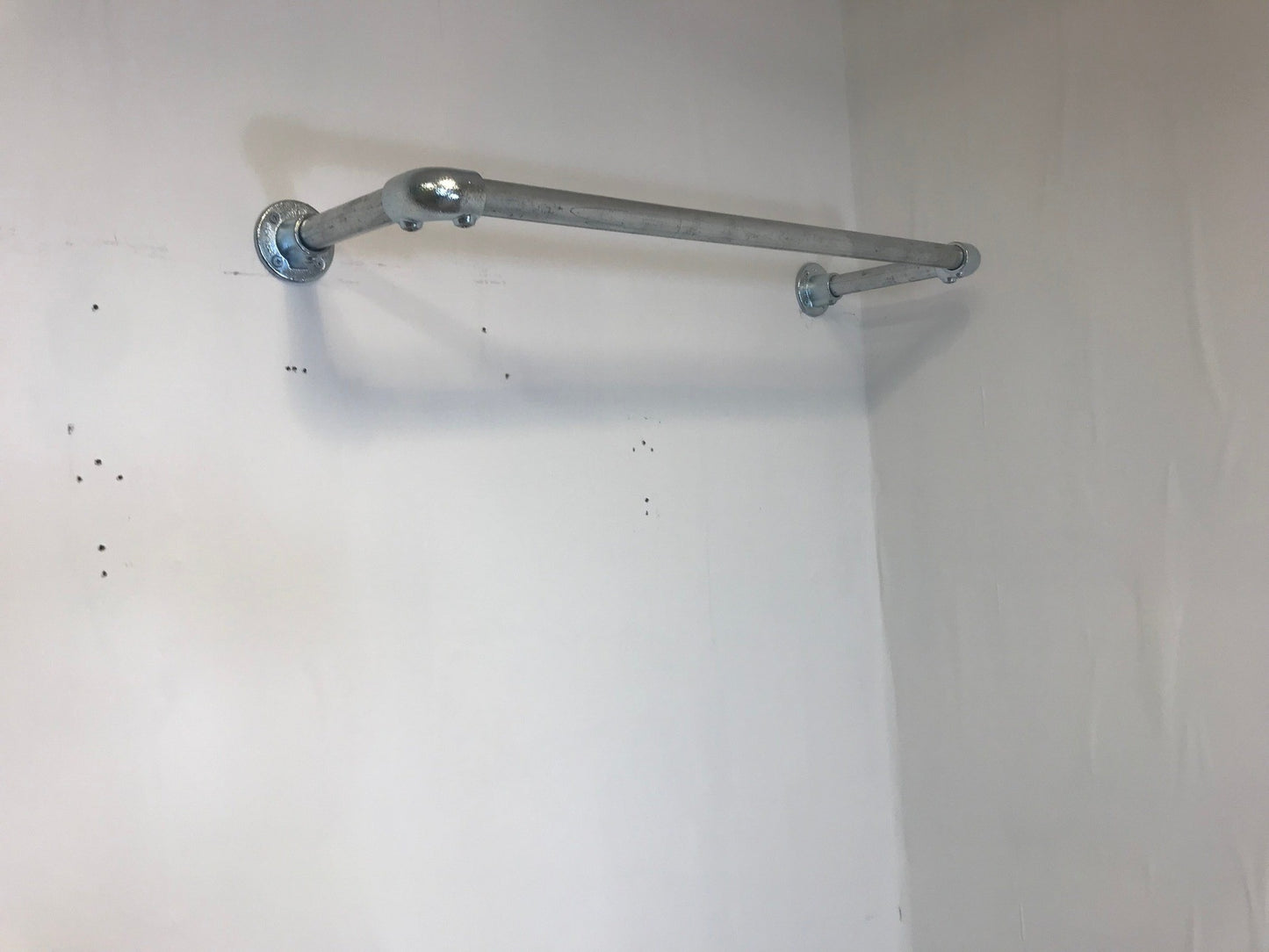 Wall fixed clothing rail in various widths. Black or galvanised silver.